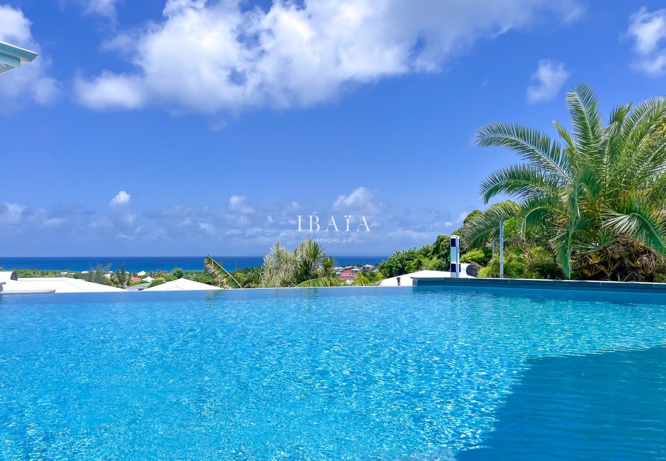 View of an infinity pool with blue sky