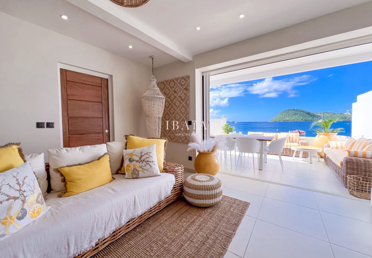 View from a living room to a terrace and the sea